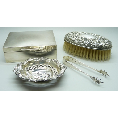 7149 - Four silver items, cigarette box, Walker & Hall, brush, pierced dish, a/f and a pair of sugar bows, ... 