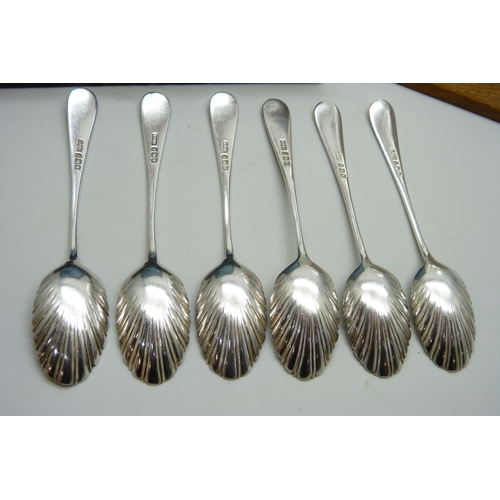 7150 - A set of six silver teaspoons, 86g, a set of six silver plated Art Nouveau spoons, cased, and a whit... 