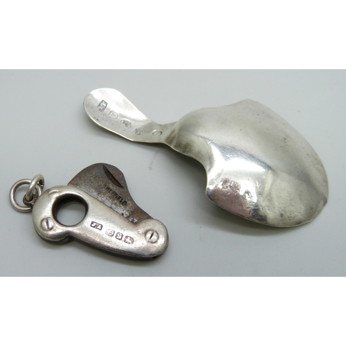 7160 - A silver caddy spoon, Birmingham 1896, and a Victorian silver mounted cigar cutter, Birmingham 1892