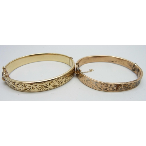 7169 - A 9ct gold bangle, 12.9g, a small silver bangle, a 9ct metal core bangle and one other