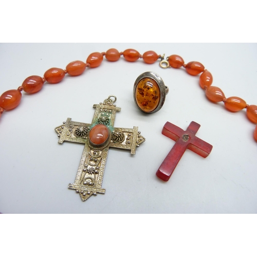 7180 - A bead necklace, a silver cross pendant, one other a/f, and a silver and amber ring, J