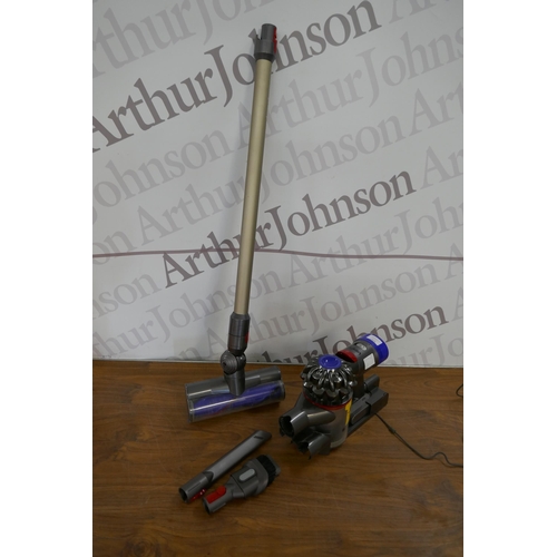 5257 - A Dyson handheld hoover with battery, charger and attachments