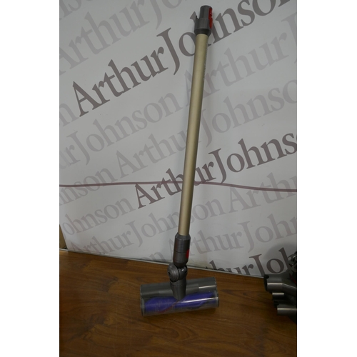 5257 - A Dyson handheld hoover with battery, charger and attachments