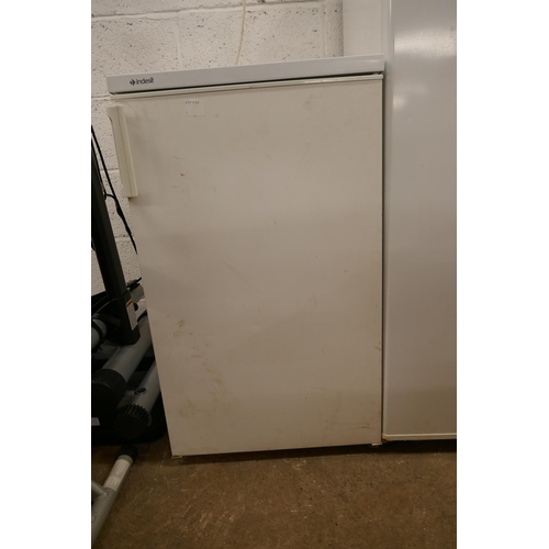 5263 - An Indesit under counter free standing fridge