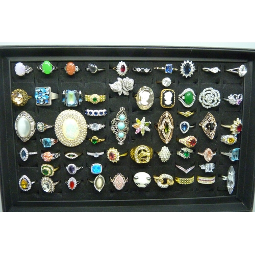 7219 - A collection of sixty-two costume rings in presentation box