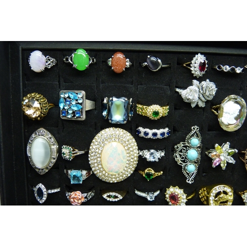 7219 - A collection of sixty-two costume rings in presentation box