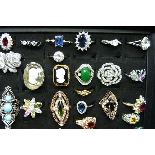 7219 - A collection of sixty-two costume rings in presentation box