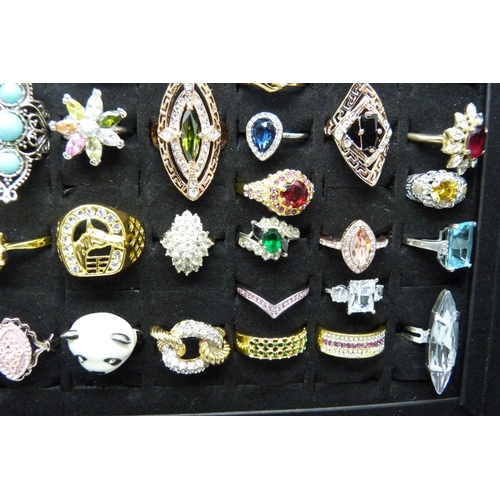 7219 - A collection of sixty-two costume rings in presentation box