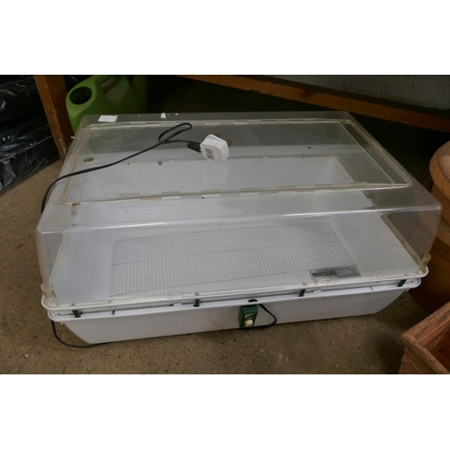 5379 - A large quantity of plastic plant pots and an electric propagator-brooder