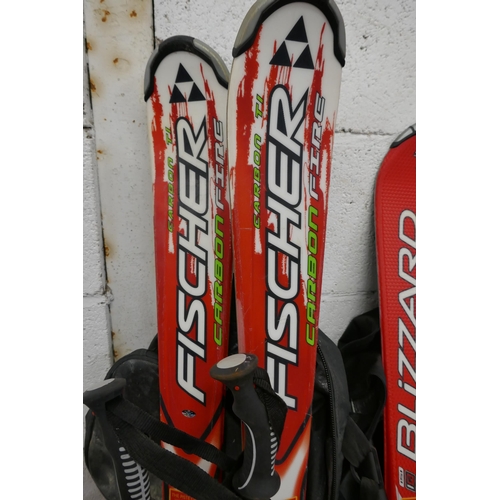 5382 - A pair of Fisher Carbofire skis and a pair of Blizzard X06 skis and a pair of Nordica Speed Machine ... 