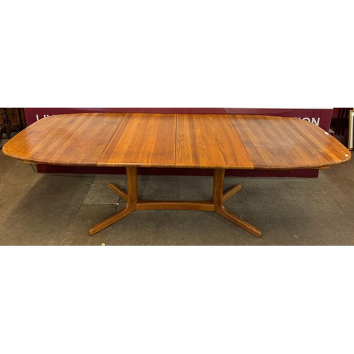 67 - A Danish teak extending dining table and six chairs