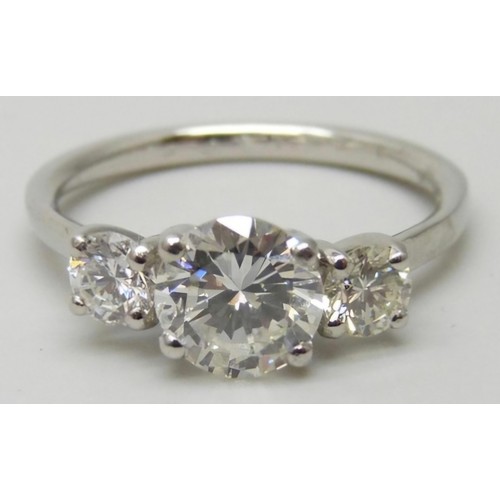 7001 - A hallmarked platinum three stone diamond ring, total diamond weight 1.40cts, centre stone 0.98ct, 3... 