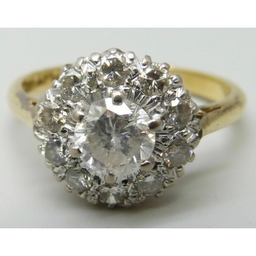 7010 - An 18ct gold and diamond ring, main stone approximately 0.75 carat weight, 4.2g, P