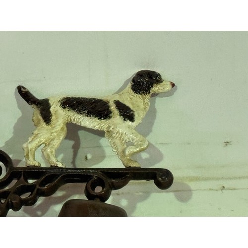 5168 - A cast metal Springer Spaniel bell with wall bracket* This lot is subject to VAT