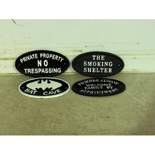 5180 - 4 cast metal oval plaques including 