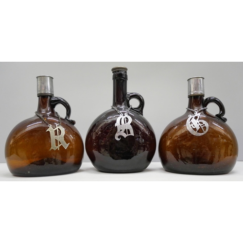 2001 - Three William IV amber glass onion decanters, with Gin, Ruby and Brandy spirit labels