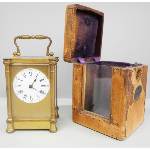 2011 - A 19th Century gilt brass carriage clock, with key and in a fitted traveling case