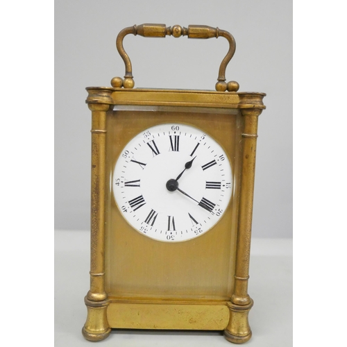 2011 - A 19th Century gilt brass carriage clock with key in a fitted travel case