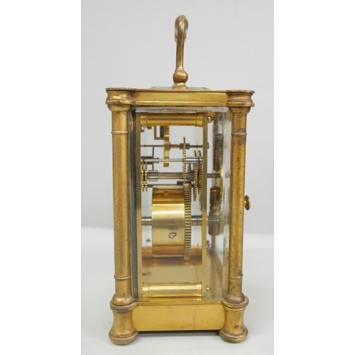 2011 - A 19th Century gilt brass carriage clock, with key and in a fitted traveling case