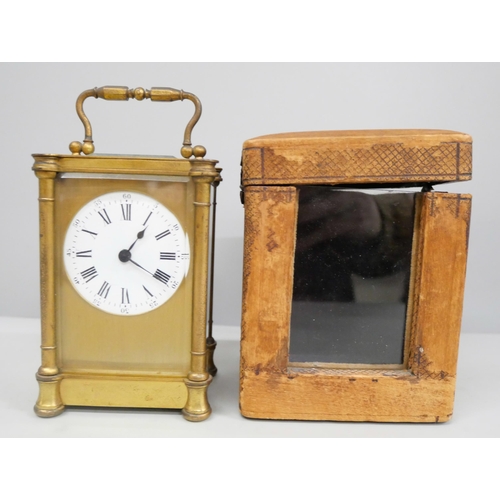 2011 - A 19th Century gilt brass carriage clock with key in a fitted travel case