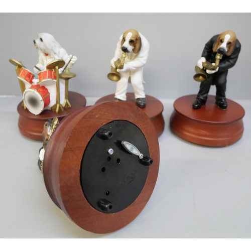 2037 - Four musical dog figures, three boxed (two unstuck from base)