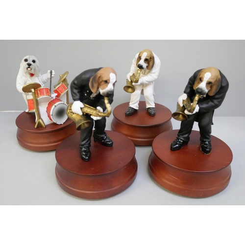 2037 - Four musical dog figures, three boxed (two unstuck from base)