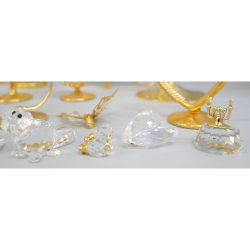 2043 - Ten small Swarovski crystal ornaments and other brass and crystal ornaments