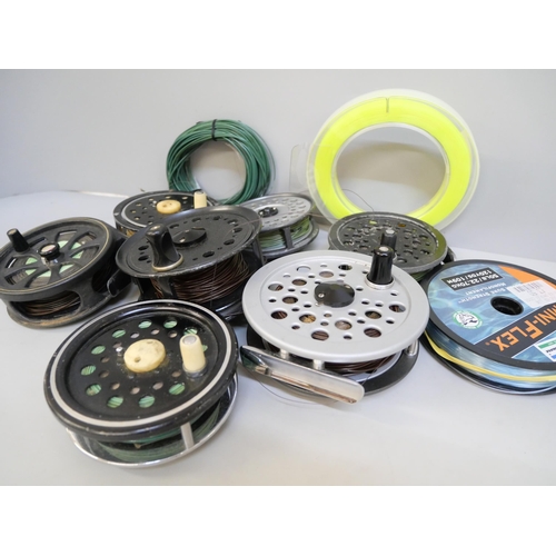 2067 - A collection of seven fly fishing reels and line