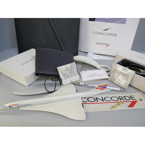 2072 - A collection of Concorde collectables, wallet, napkin rings, pen, stationery, tickets, menus, plasti... 