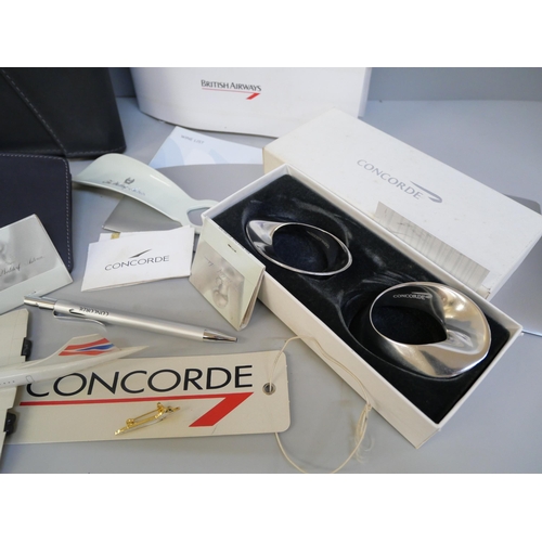 2072 - A collection of Concorde collectables, wallet, napkin rings, pen, stationery, tickets, menus, plasti... 