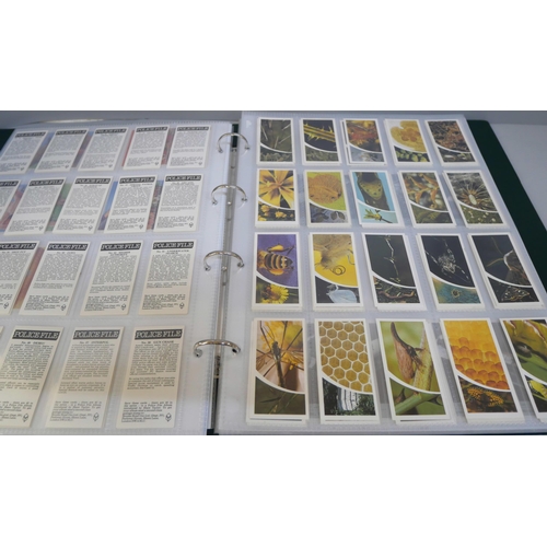 2082 - A folder of cigarette cards, confectionary and tea cards, part and full sets