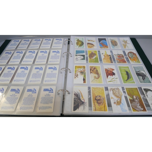 2082 - A folder of cigarette cards, confectionary and tea cards, part and full sets