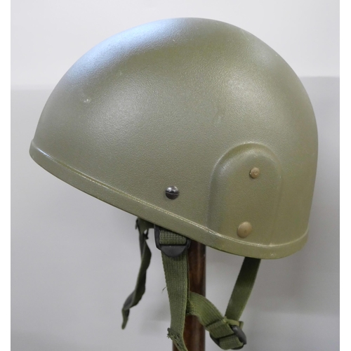 2139 - A British army helmet, Bosnia conflict, a beret, bone handled knife and a canvas bag *This lot Not A... 