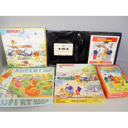 2156 - Rupert the Bear Annuals, jigsaws, cassette tapes, stamp starter pack, in case and bag