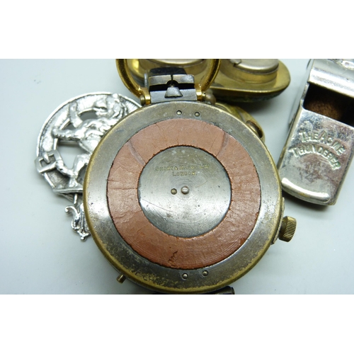 2165 - A pocket compass, Short & Mason, a double sovereign case, a magnifying glass with compass, a whistle... 