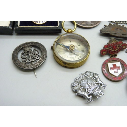 2166 - A WWI Wound badge, B316883, other badges, a coin case, a compass, etc.