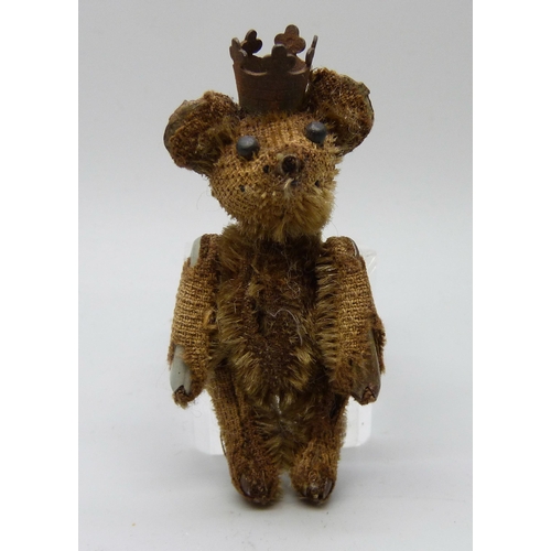 2168 - A small Teddy bear with crown, 7cm