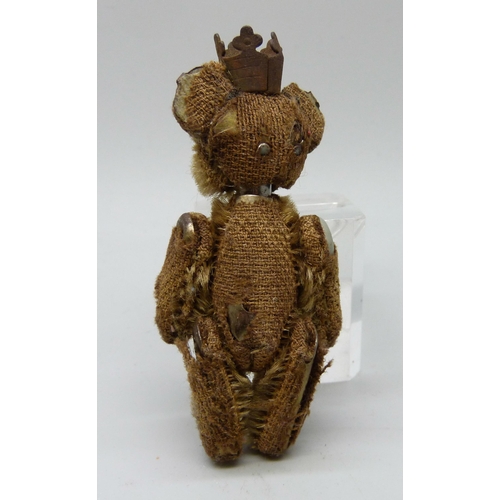 2168 - A small Teddy bear with crown, 7cm