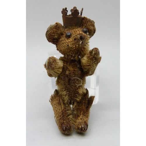 2168 - A small Teddy bear with crown, 7cm