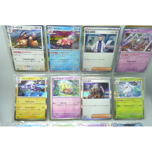 2182 - Over 500 Japanese Pokemon cards in tin with sleeved Holographic