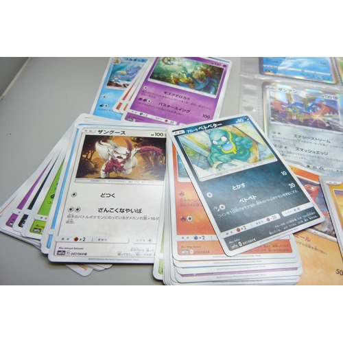 2182 - Over 500 Japanese Pokemon cards in tin with sleeved Holographic