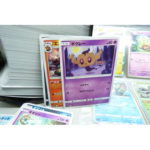 2182 - Over 500 Japanese Pokemon cards in tin with sleeved Holographic