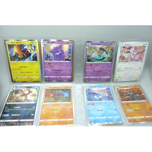 2182 - Over 500 Japanese Pokemon cards in tin with sleeved Holographic