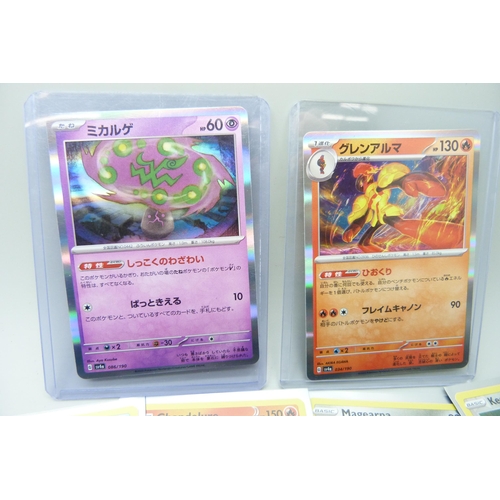 2183 - 500 + Japanese and English Pokemon cards in collectors tin including English Holographic with rare c... 