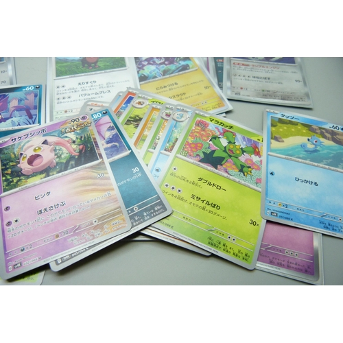 2183 - 500 + Japanese and English Pokemon cards in collectors tin including English Holographic with rare c... 