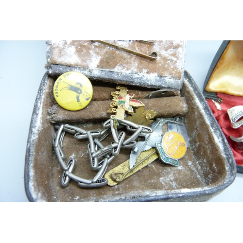 2195 - A collection of jewellery, military and other badges, purse with silver coins, compact, etc.