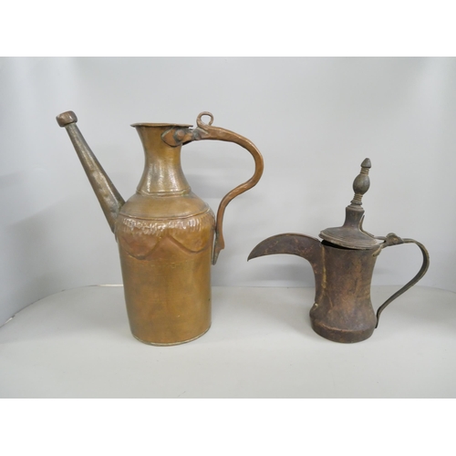 2209 - An Arabic Dallah coffee pot and one other Persian copper kettle