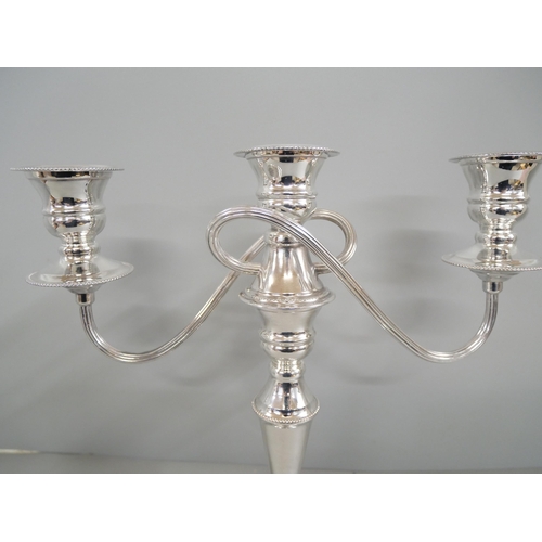 2210 - A silver plate on copper candelabra