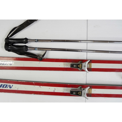 2231 - A pair of vintage Northland skis with a pair of Northland ski poles