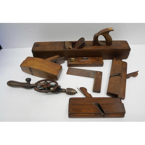 2279 - Four wooden planes, square, hand drill and spirit level  **PLEASE NOTE THIS LOT IS NOT ELIGIBLE FOR ... 